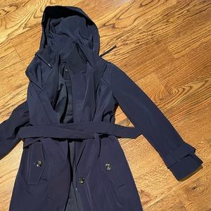 London Fog  button/ belted rain/trenchcoat w zip panel from neck to below waist